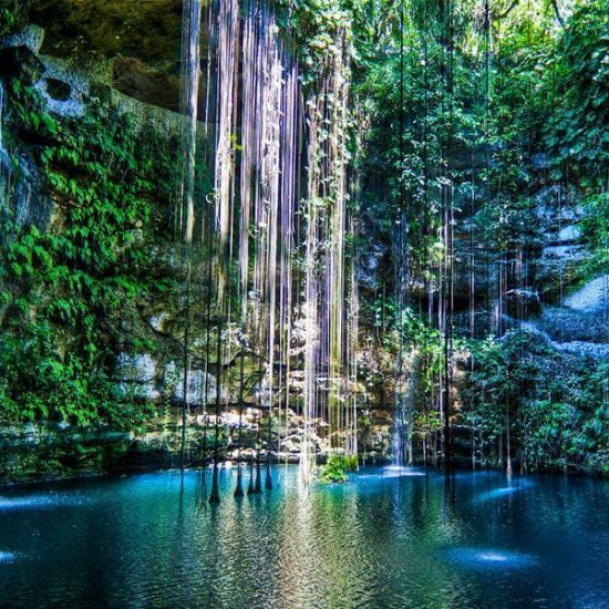 Cenote Ik-Kil is located at a close distance to the Mayan ruins of Chichen Itzain Yucatan, Mexico